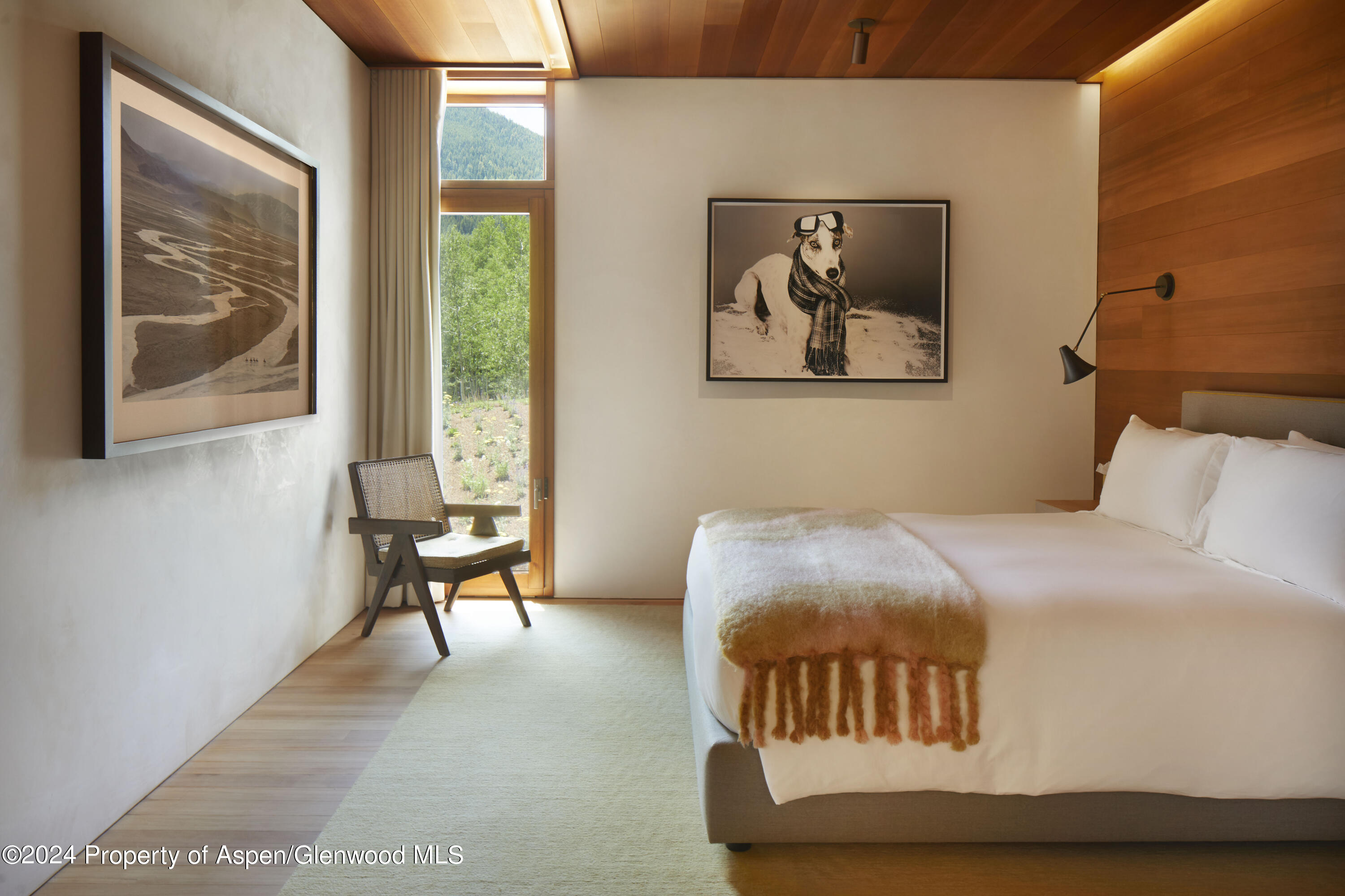 255 Conundrum Creek Road Aspen, CO 81611 - Photo 10 of 21 a bedroom with a bed and a painting on the wall