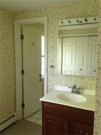 14 Johnson Road Sterling, MA 01564 - Photo 15 of 22 a bathroom with a sink and a mirror