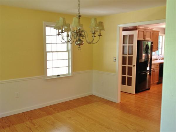 14 Johnson Road Sterling, MA 01564 - Photo 7 of 22 a view of a kitchen with stainless steel appliances wooden floor and a window
