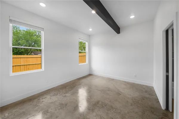 a view of an empty room with a window
