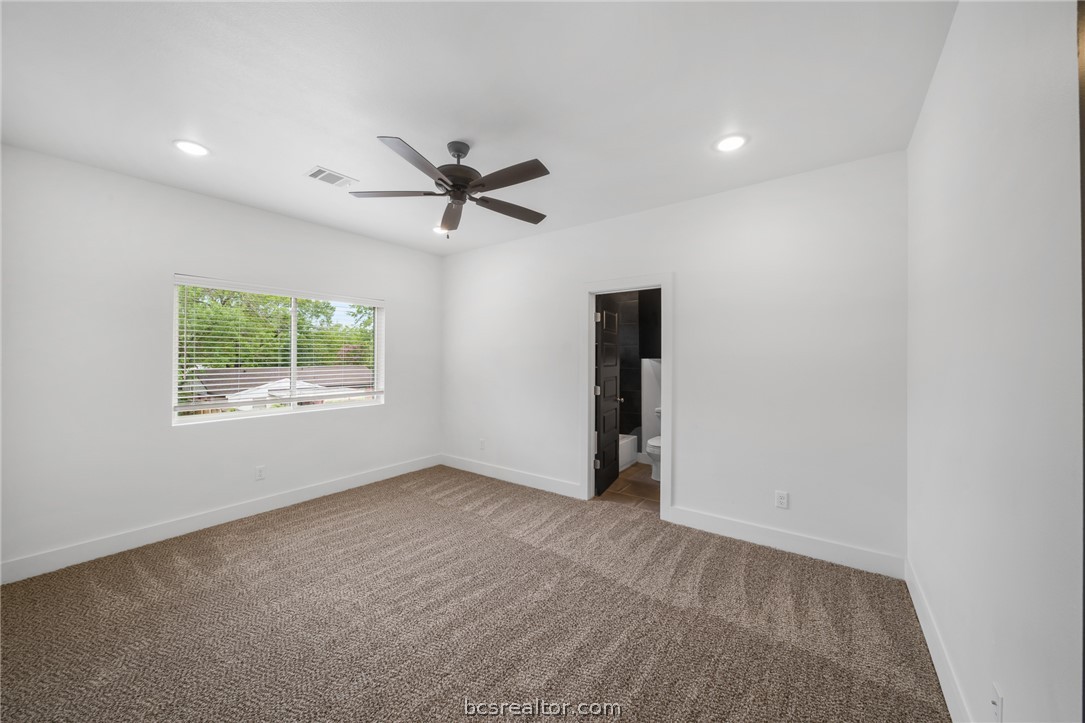 213 Lynn Drive, Unit 202 Bryan, TX 77801 - Photo 10 of 28 a view of an empty room with a window