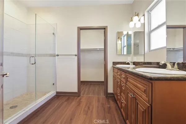 a kitchen with kitchen island a counter top space and a sink