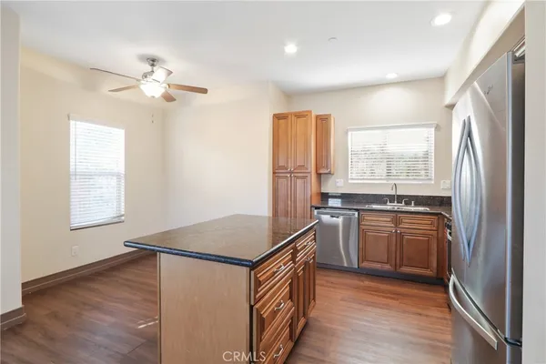 a kitchen with a refrigerator and a sink