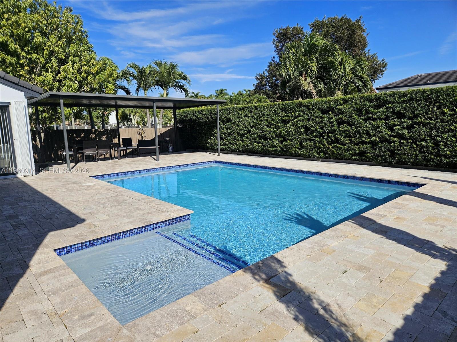 7301 Southwest 159th Avenue, Unit 1 Miami, FL 33193 - Photo 5 of 10 swimming pool view with a lake view