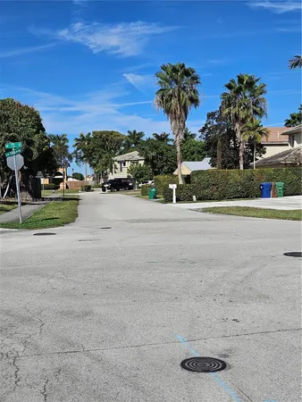 a view of a road with a building in the background