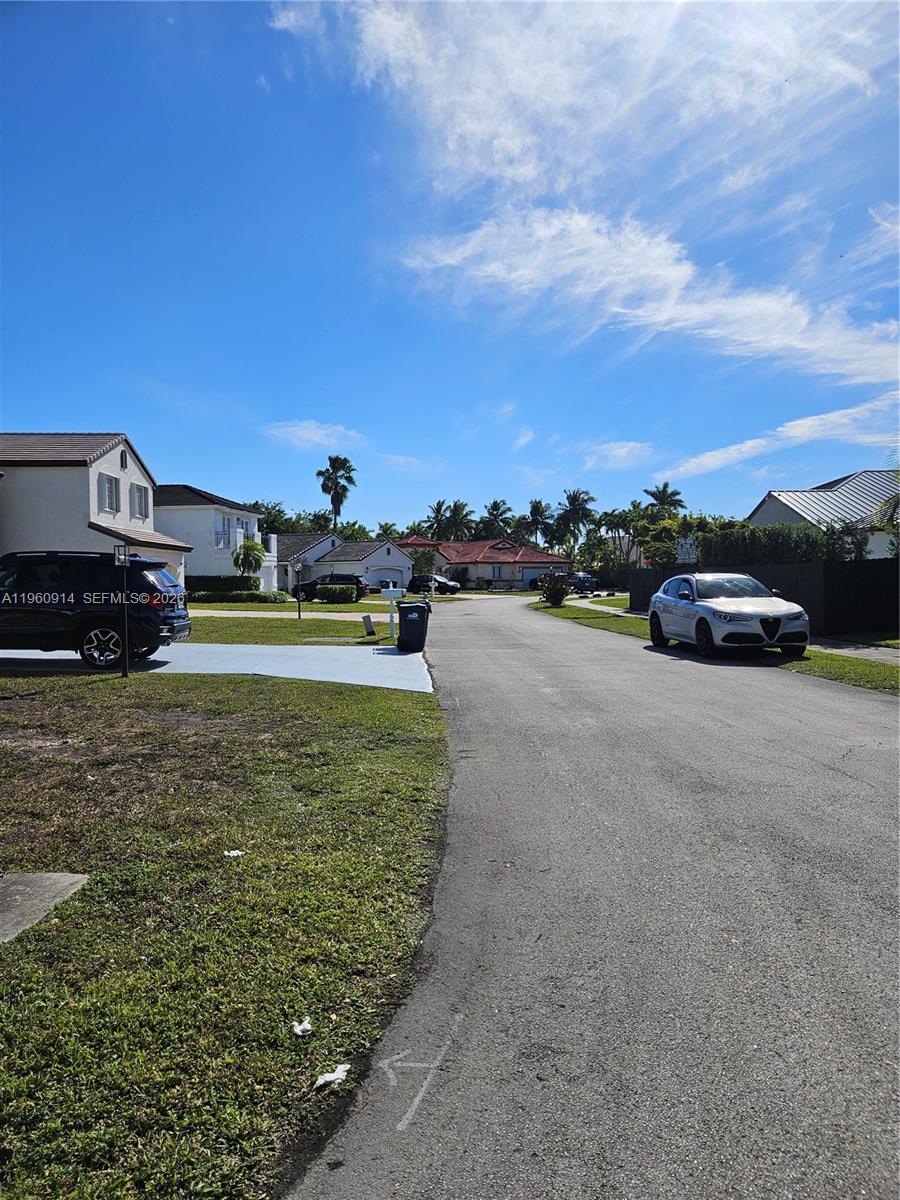 7301 Southwest 159th Avenue, Unit 1 Miami, FL 33193 - Photo 10 of 10 a view of a street with a car parked in the background