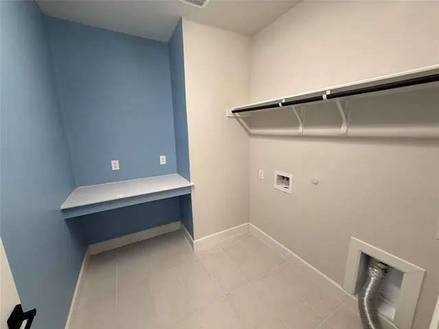 a room with a bench and vanity