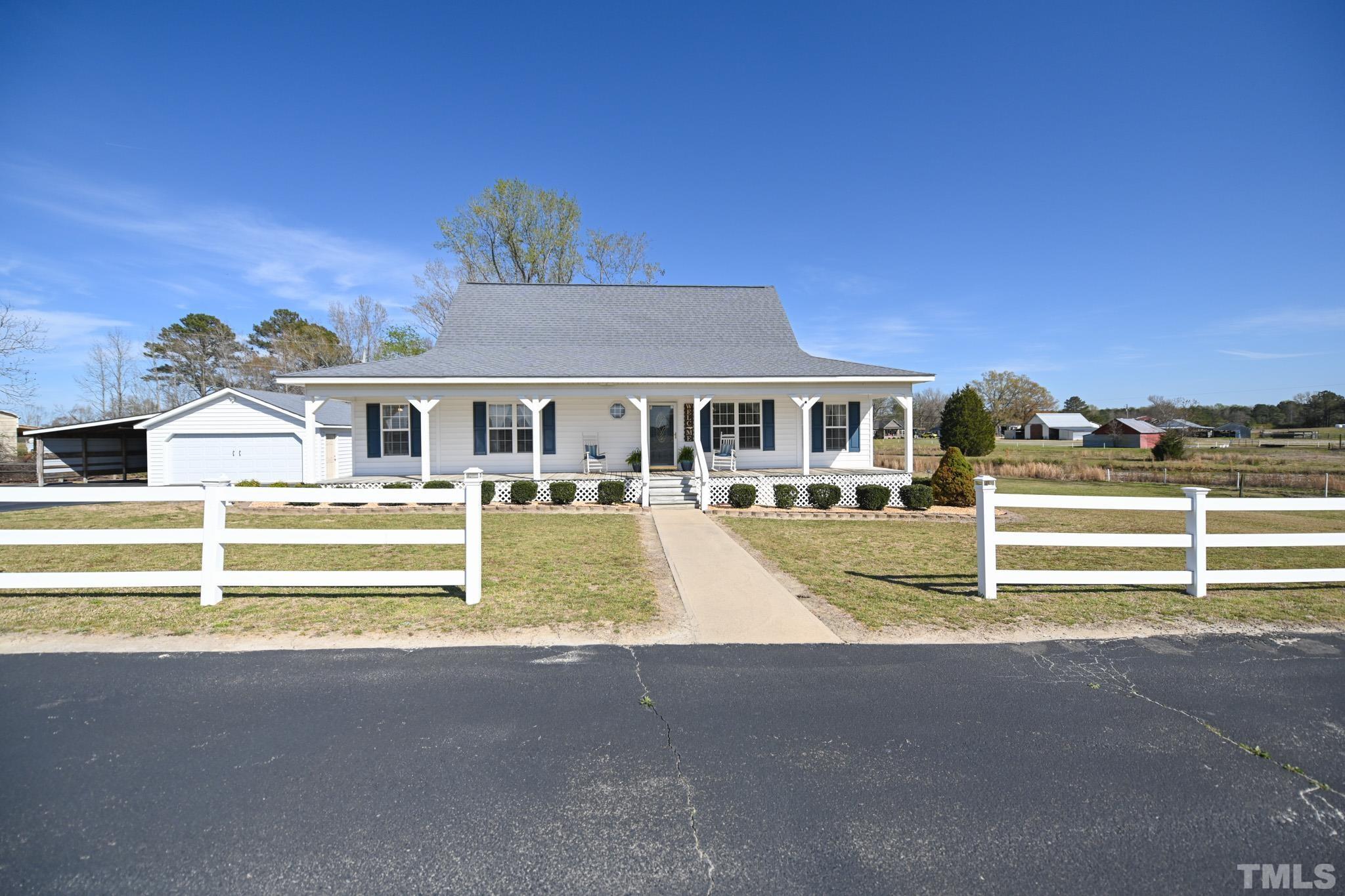 a view of house with a swimming pool