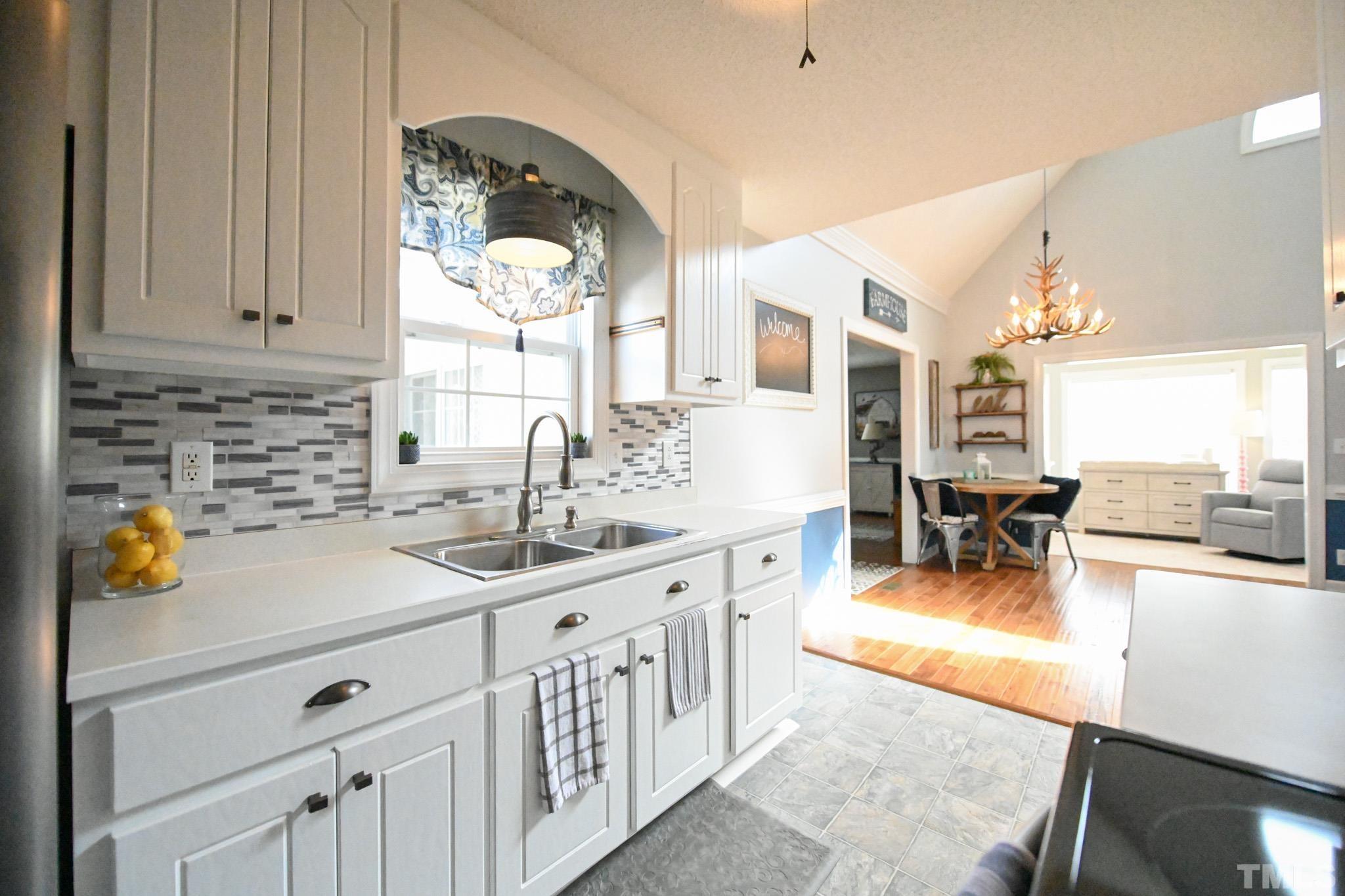 4071 Bizzell Grove Church Road Princeton, NC 27569 - Photo 17 of 53 a kitchen with stainless steel appliances granite countertop a sink and cabinets