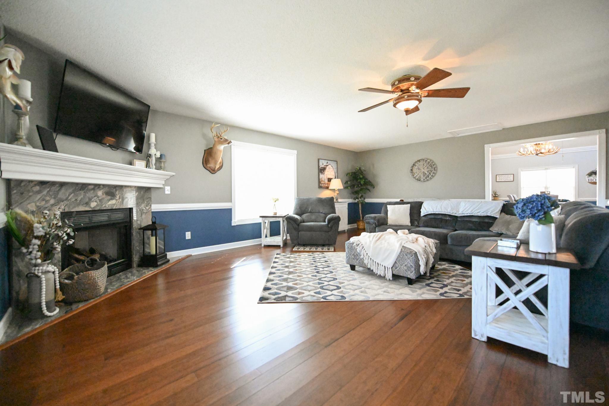 4071 Bizzell Grove Church Road Princeton, NC 27569 - Photo 20 of 53 a living room with furniture and a fireplace