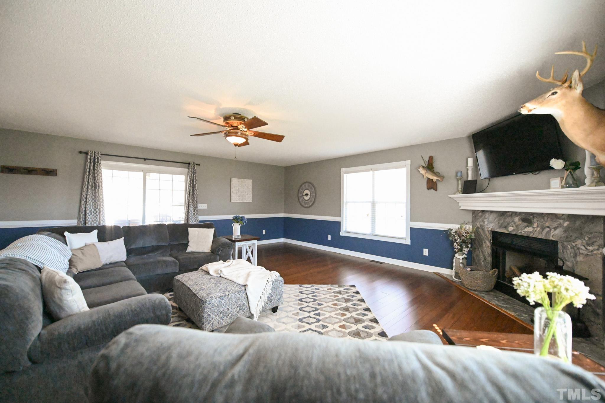 4071 Bizzell Grove Church Road Princeton, NC 27569 - Photo 21 of 53 a living room with furniture and a fireplace