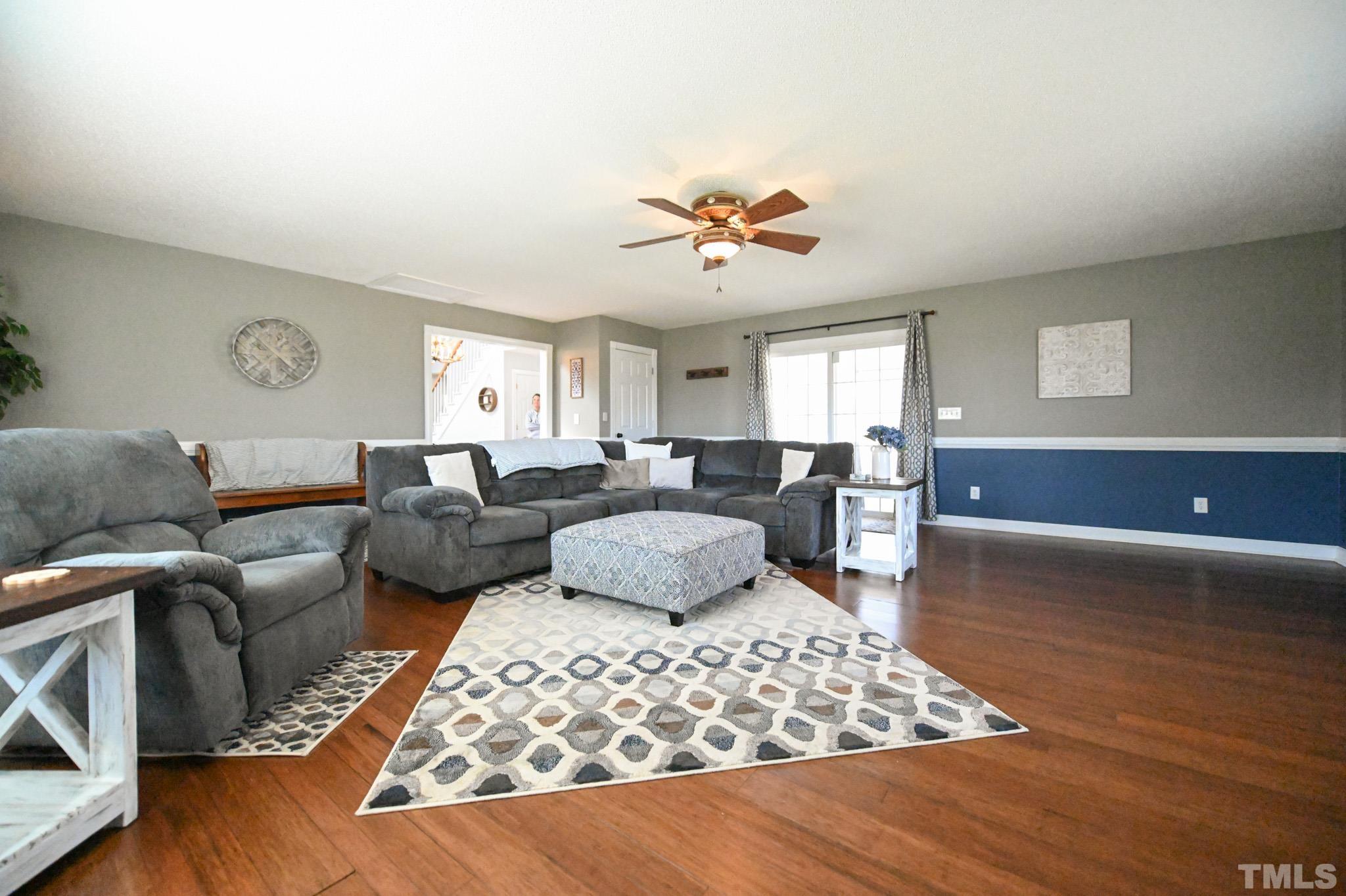 4071 Bizzell Grove Church Road Princeton, NC 27569 - Photo 24 of 53 a living room with furniture windows and a wooden floor