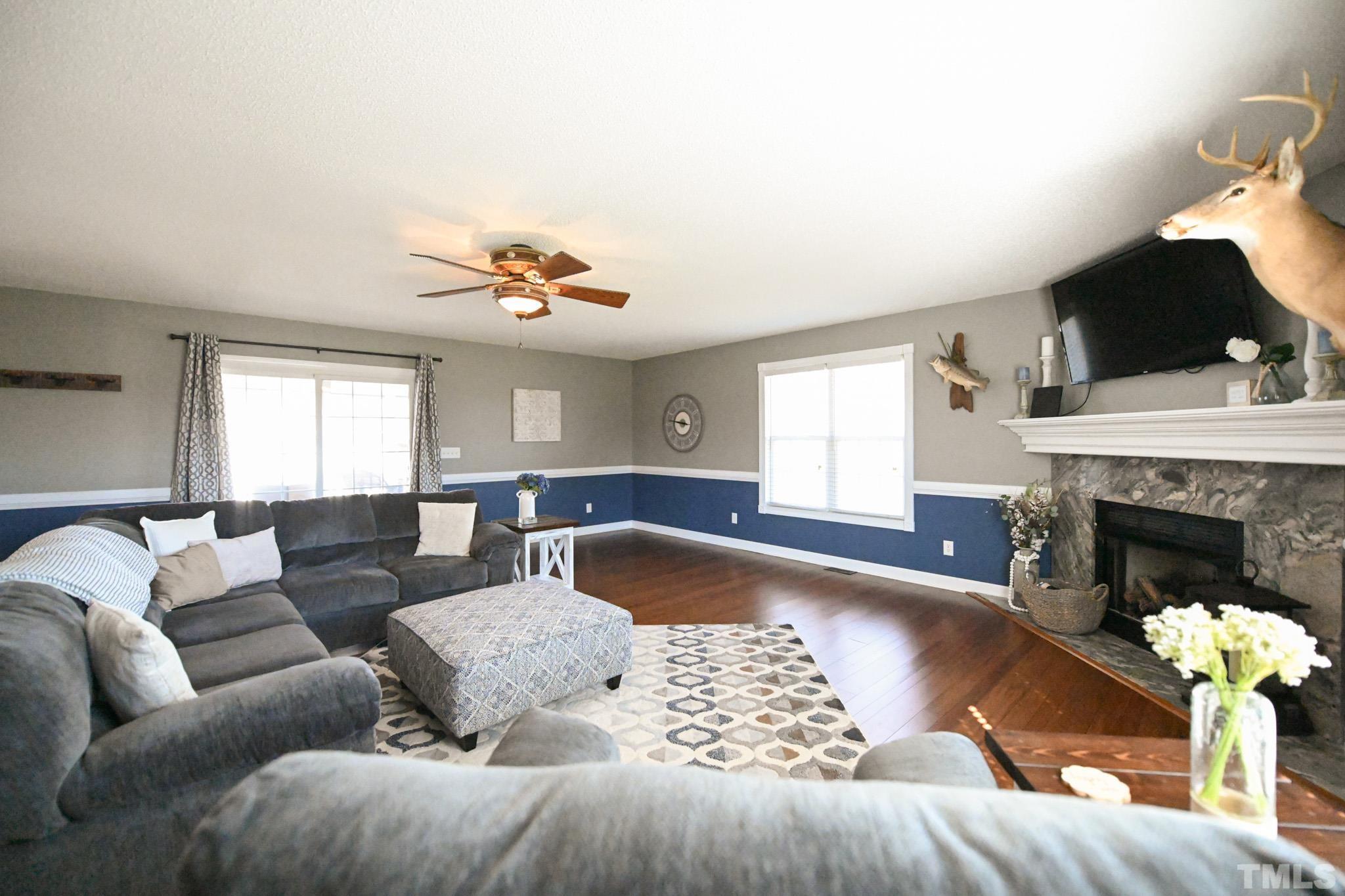 4071 Bizzell Grove Church Road Princeton, NC 27569 - Photo 25 of 53 a living room with furniture and a fireplace