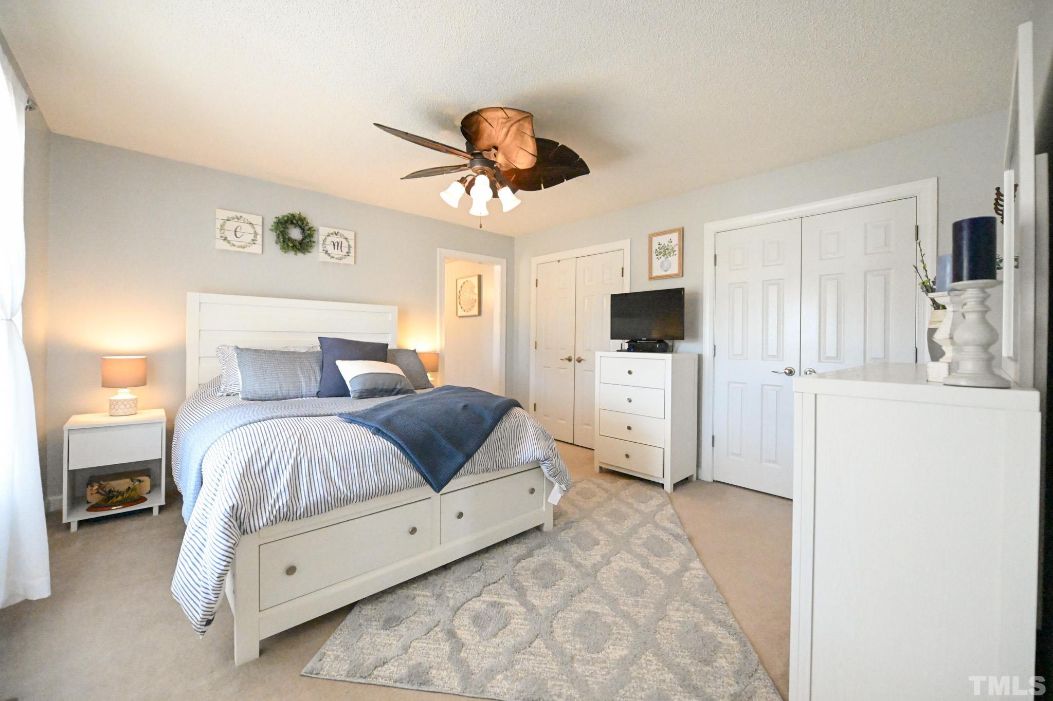 4071 Bizzell Grove Church Road Princeton, NC 27569 - Photo 28 of 53 a bedroom with a large bed and a tv