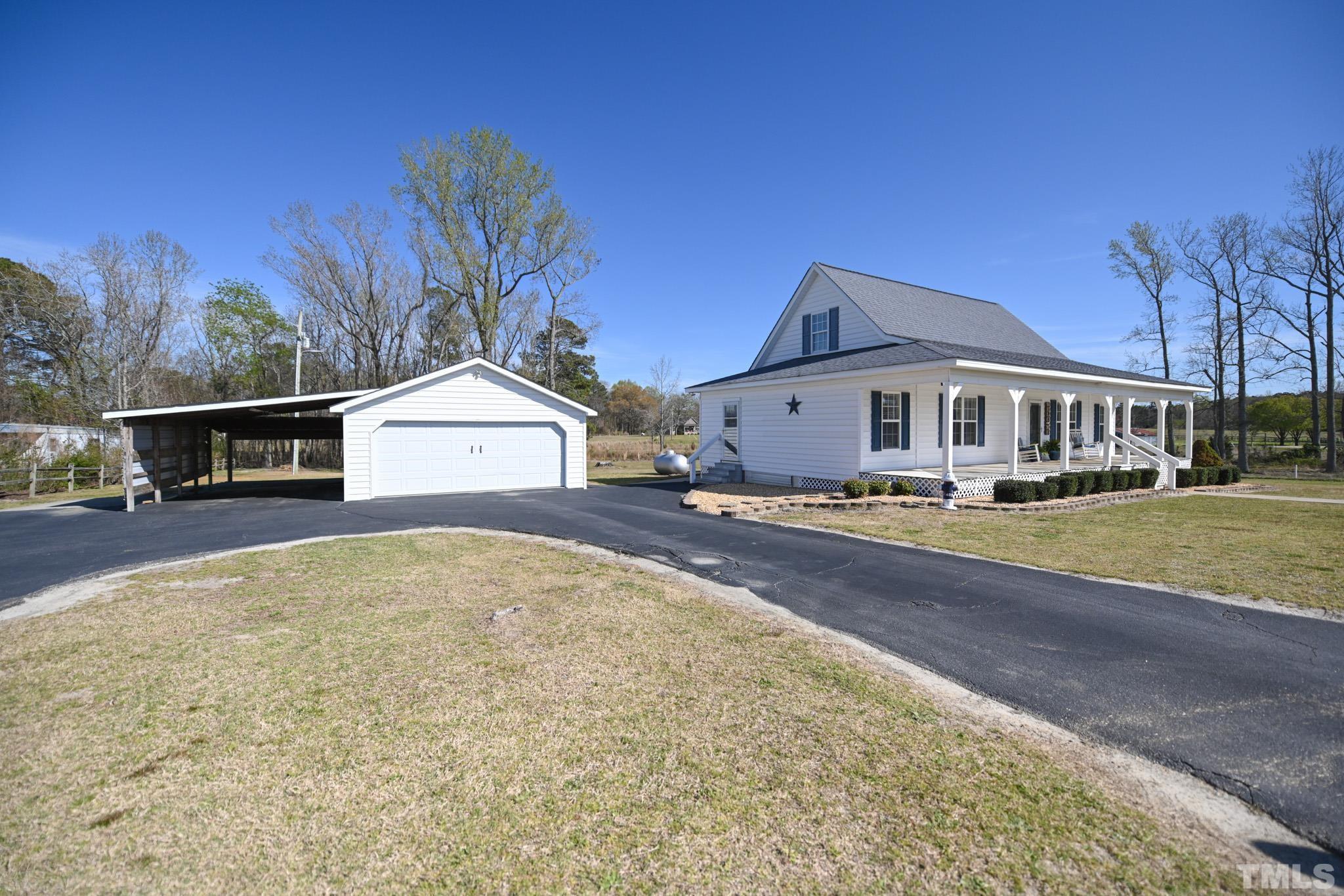 4071 Bizzell Grove Church Road Princeton, NC 27569 - Photo 3 of 53 a front view of a house with a yard