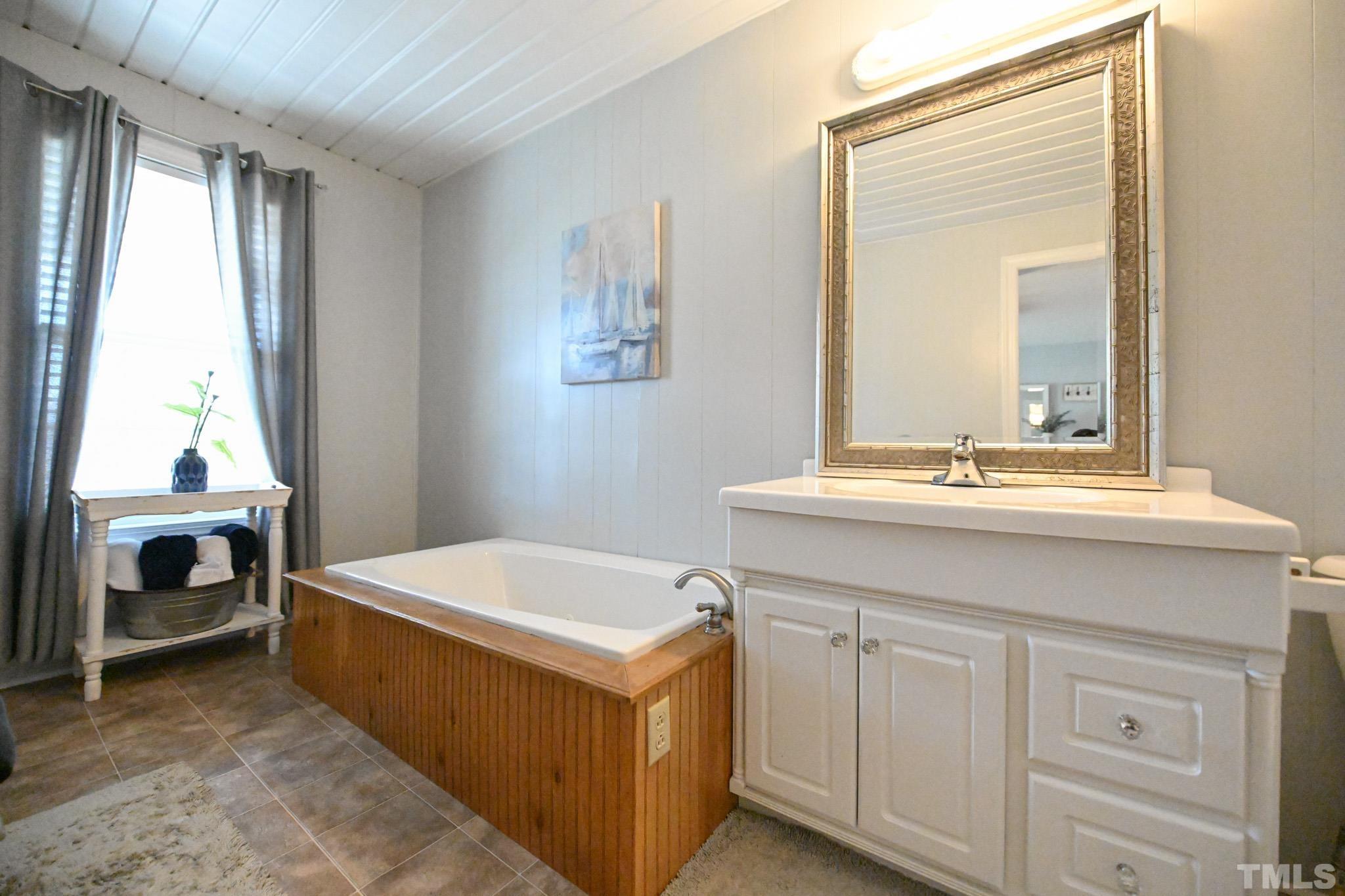 4071 Bizzell Grove Church Road Princeton, NC 27569 - Photo 31 of 53 a bathroom with a sink and a mirror