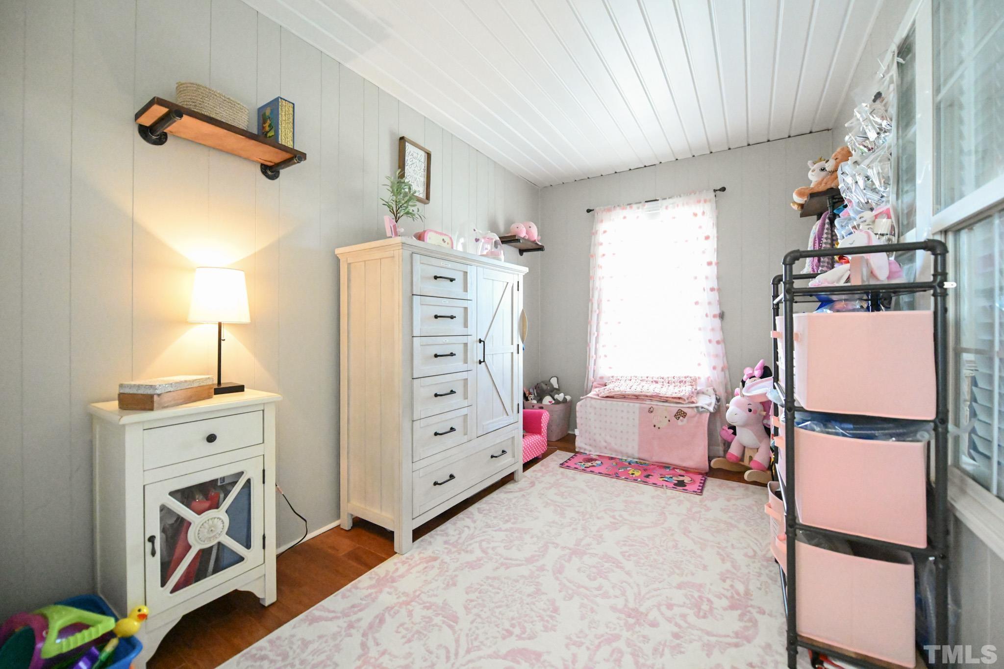 4071 Bizzell Grove Church Road Princeton, NC 27569 - Photo 36 of 53 a bedroom with a bed and a window