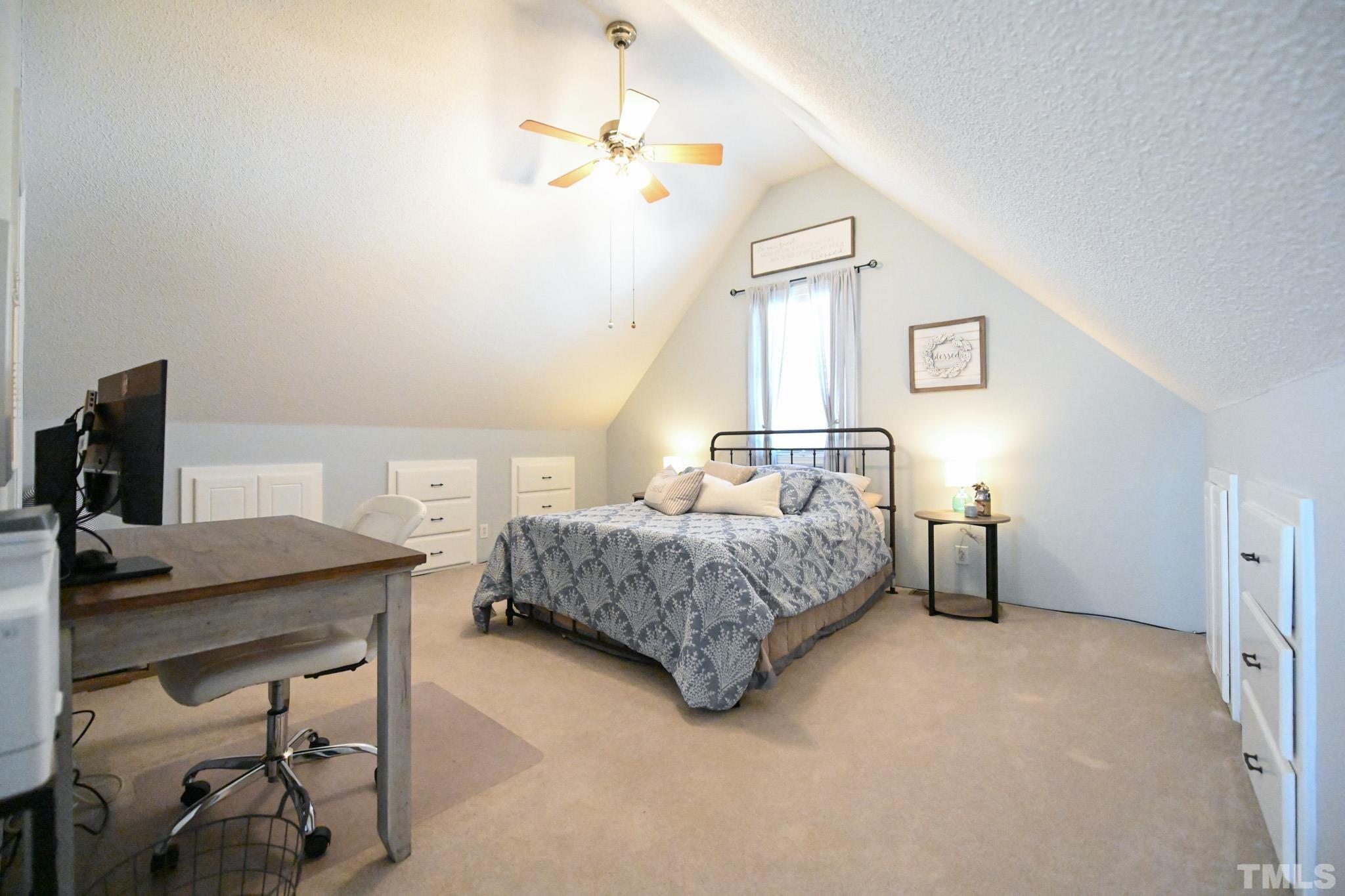 4071 Bizzell Grove Church Road Princeton, NC 27569 - Photo 39 of 53 a bedroom with a bed and a desk