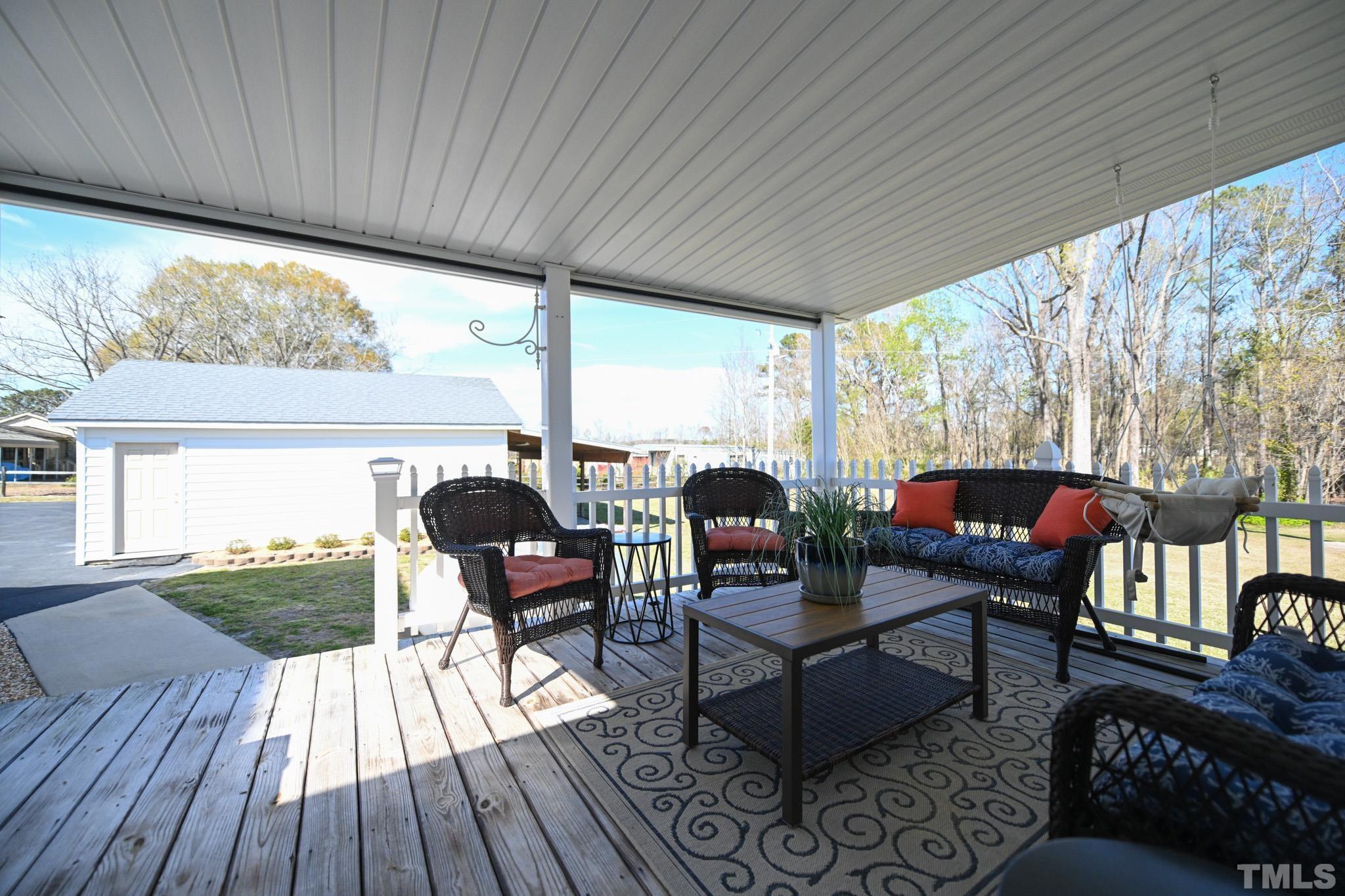 4071 Bizzell Grove Church Road Princeton, NC 27569 - Photo 45 of 53 a outdoor living space with furniture and wooden floor