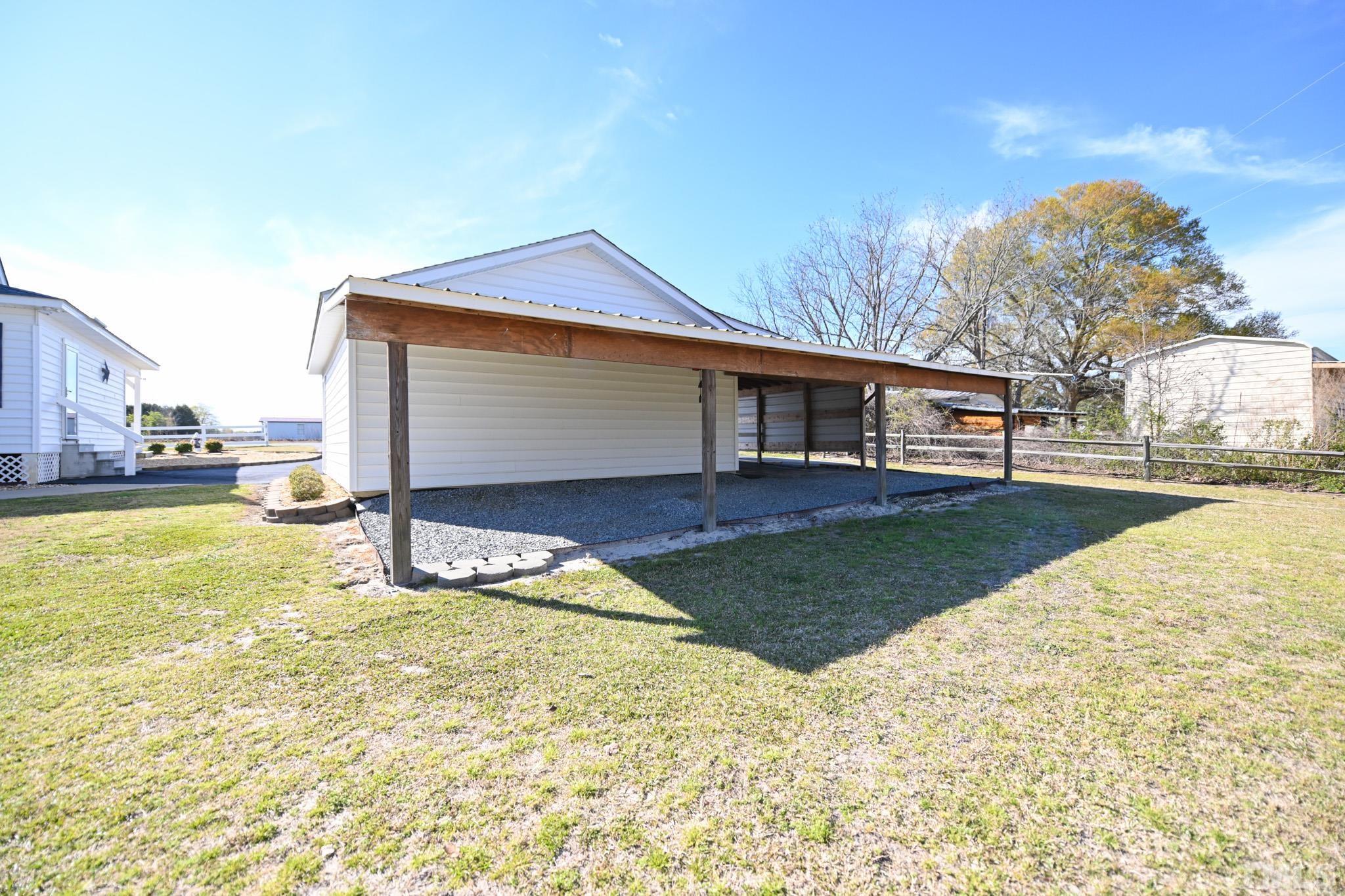 4071 Bizzell Grove Church Road Princeton, NC 27569 - Photo 49 of 53 a view of an house with backyard and trees