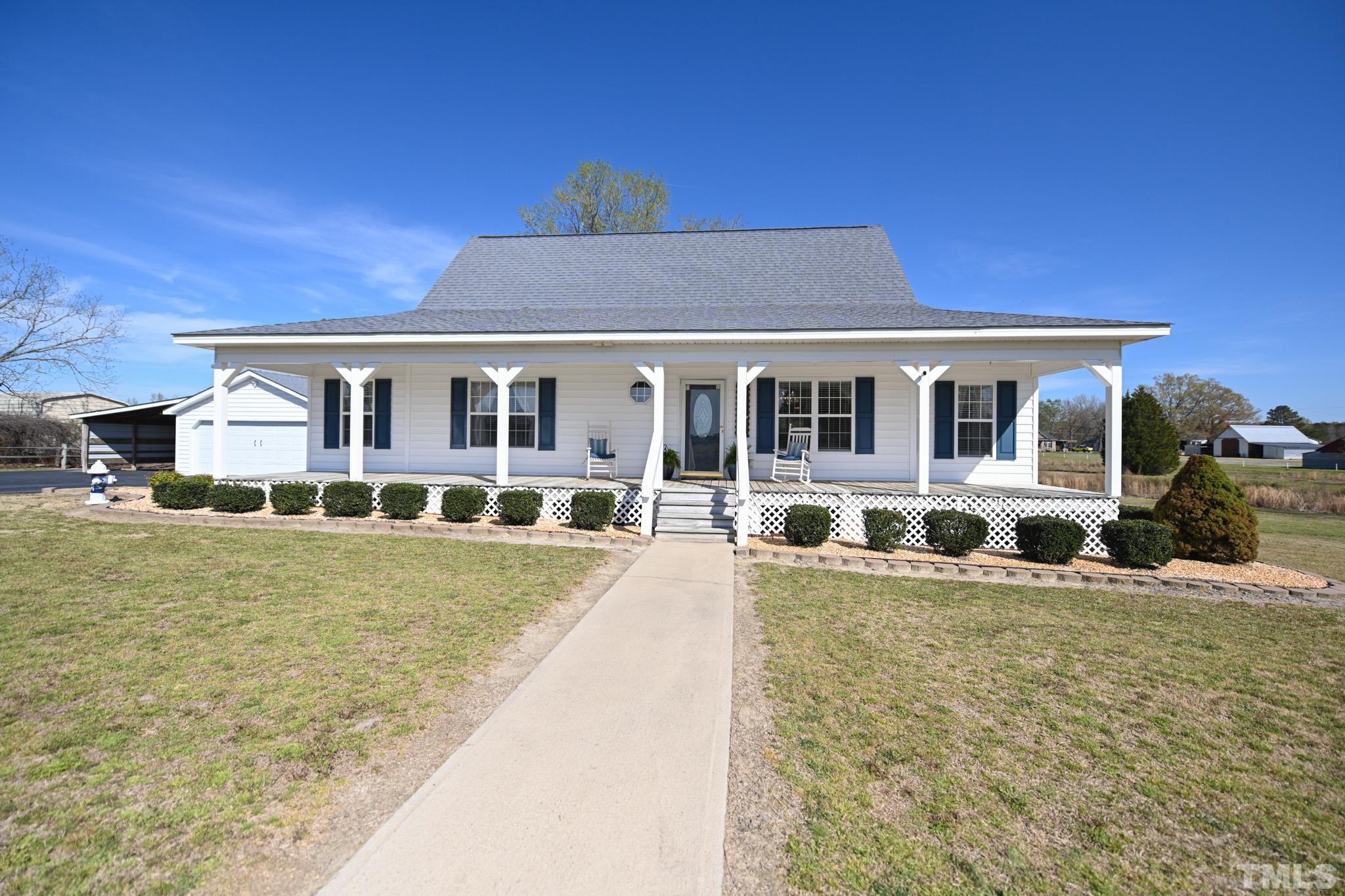4071 Bizzell Grove Church Road Princeton, NC 27569 - Photo 5 of 53 a front view of a building with swimming pool