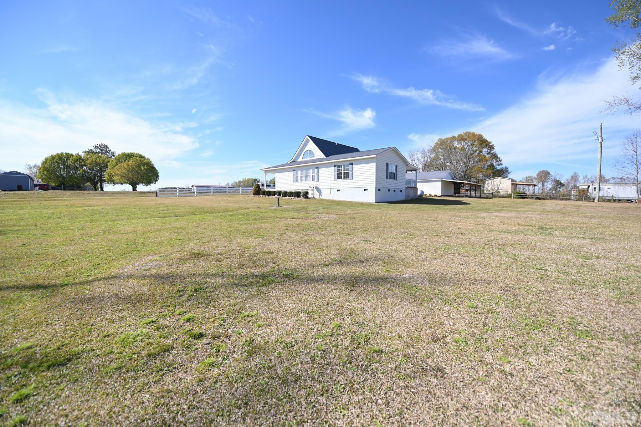 4071 Bizzell Grove Church Road Princeton, NC 27569 - Photo 51 of 53 a front view of a house with a yard