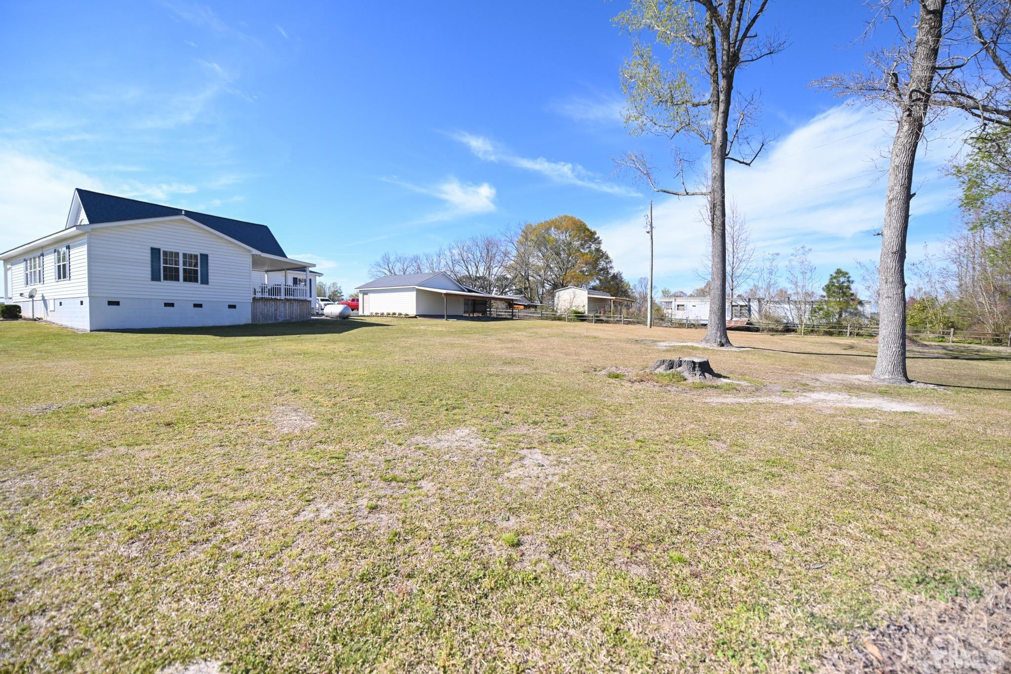 4071 Bizzell Grove Church Road Princeton, NC 27569 - Photo 52 of 53 a view of a house with a yard