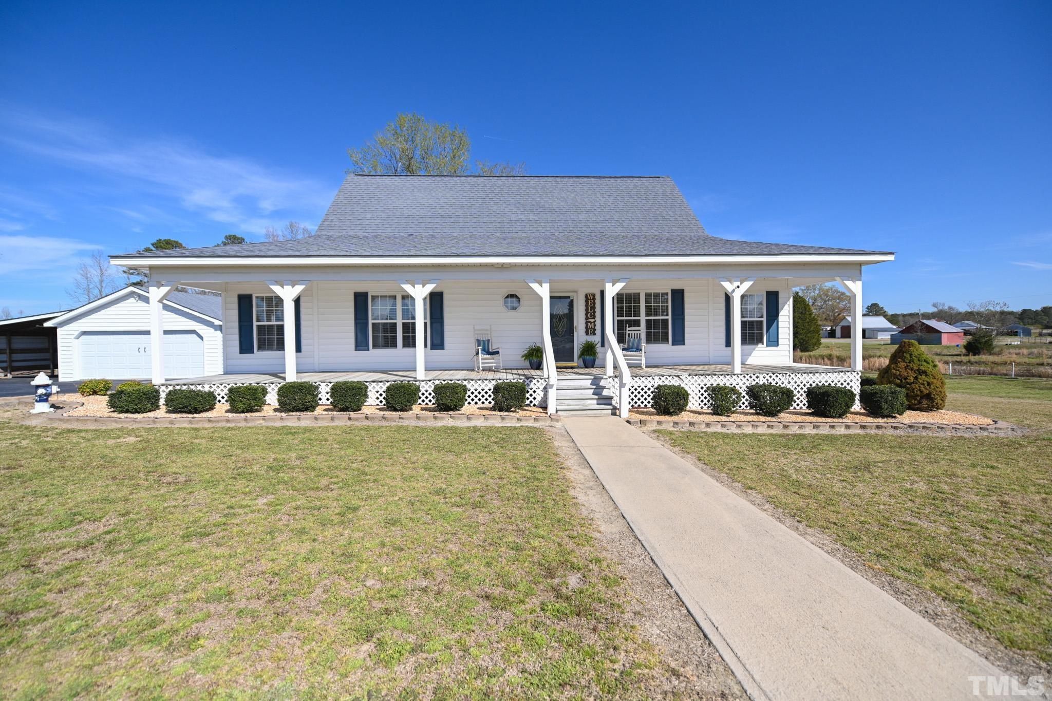 4071 Bizzell Grove Church Road Princeton, NC 27569 - Photo 6 of 53 a front view of a house with swimming pool