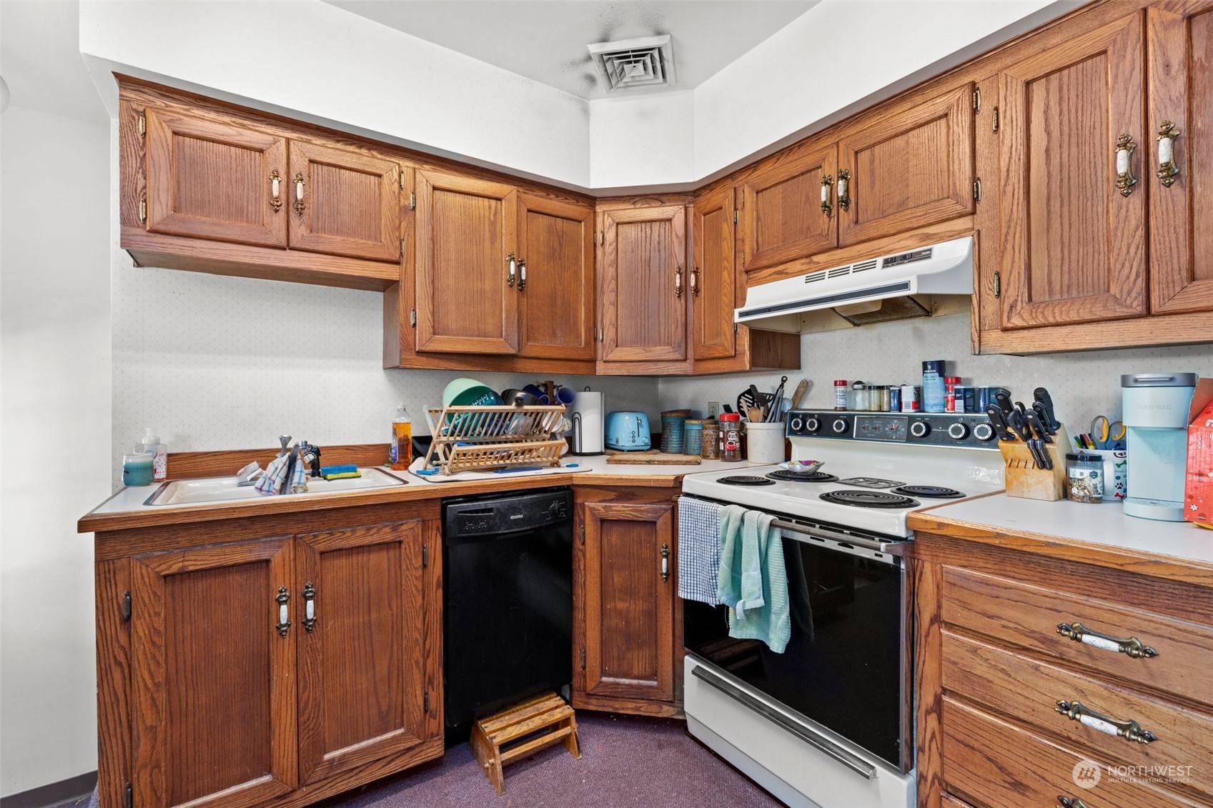 508 Delafield Avenue Richland, WA 99352 - Photo 6 of 22 a kitchen with stainless steel appliances granite countertop a stove a sink dishwasher and cabinets with wooden cabinets