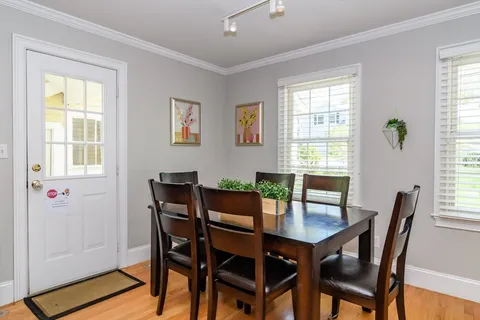 a view of a dining room with furniture and window