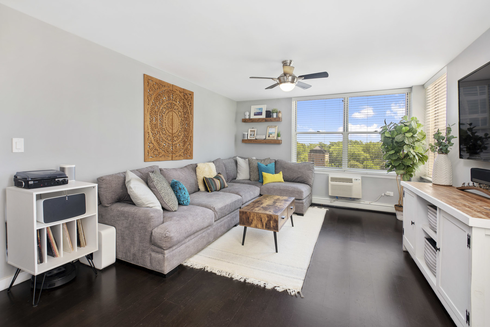 3033 North Sheridan Road, Unit 605 Chicago, IL 60657 - Photo 2 of 13 a living room with furniture and a large window
