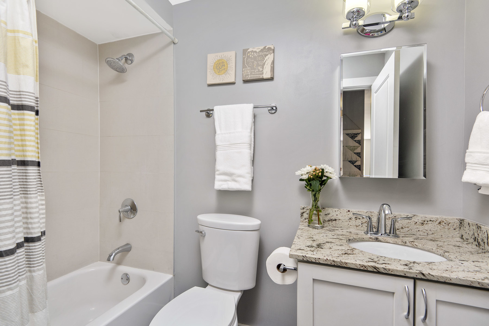 3033 North Sheridan Road, Unit 605 Chicago, IL 60657 - Photo 12 of 13 a bathroom with a granite countertop sink toilet and shower