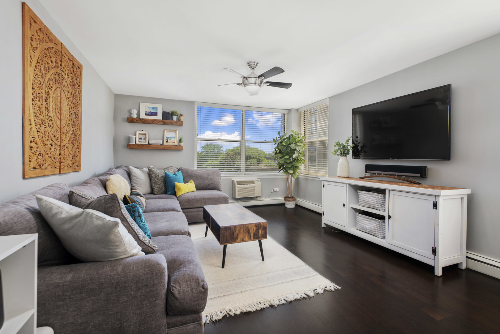 3033 North Sheridan Road, Unit 605 Chicago, IL 60657 - Photo 3 of 13 a living room with furniture and a flat screen tv