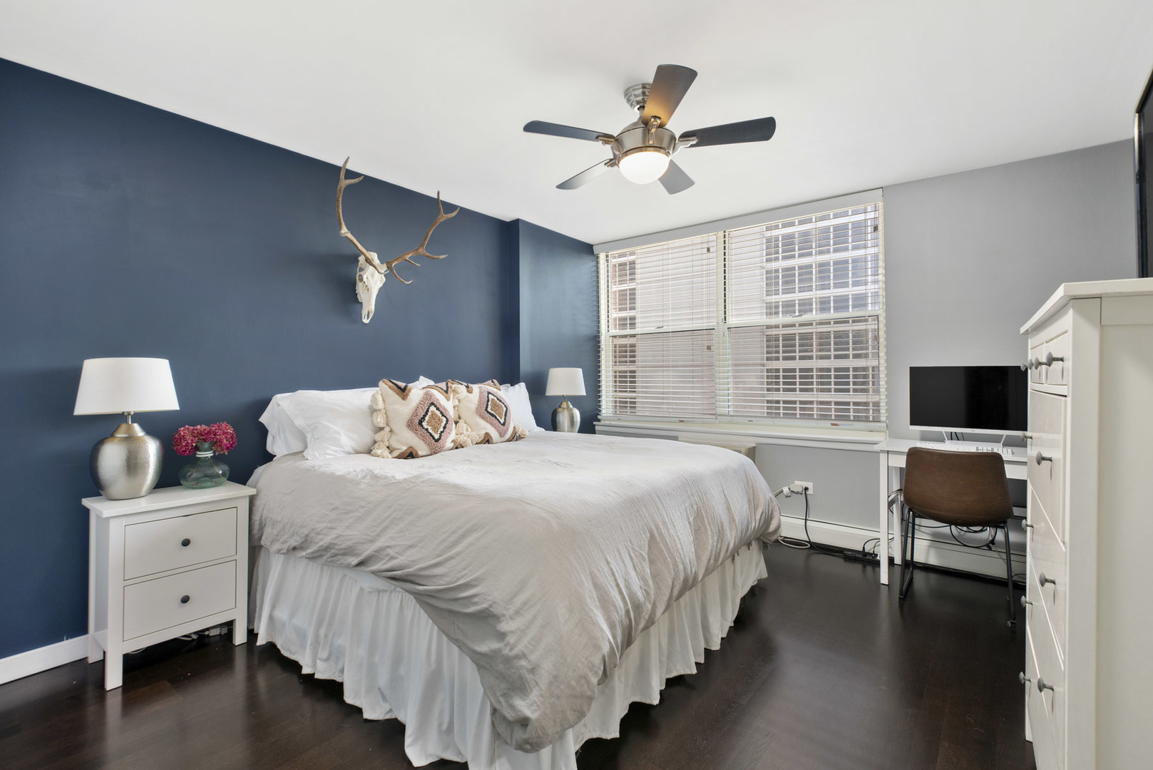 3033 North Sheridan Road, Unit 605 Chicago, IL 60657 - Photo 8 of 13 a bedroom with bed tv and window