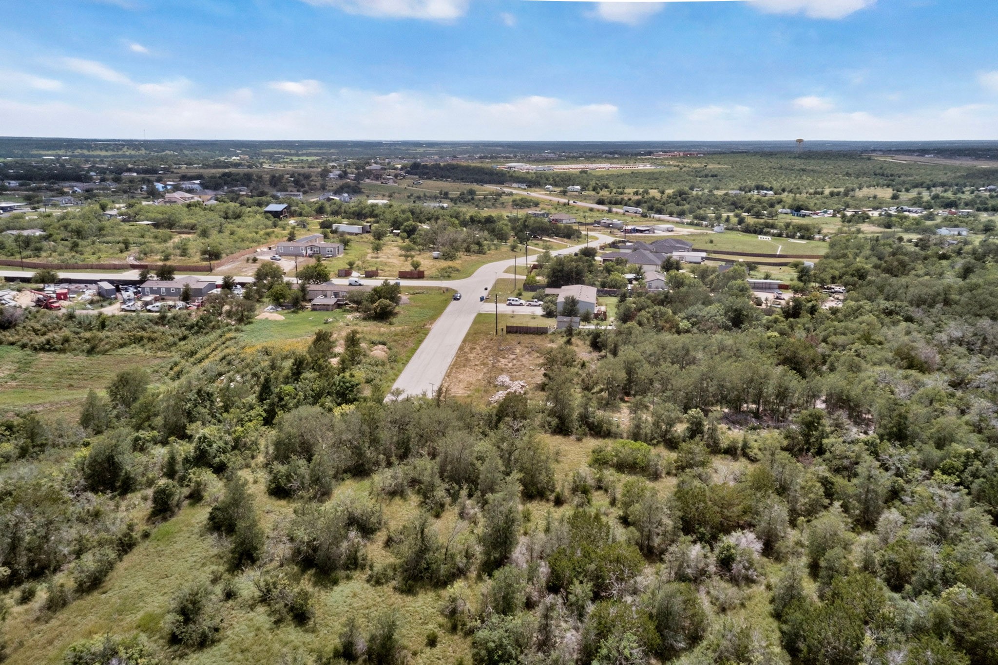 693 Santa Teresa Road Kyle, TX 78640 - Photo 9 of 20 Vast natural landscapes encompass this secluded residential parcel, ready for your custom build.