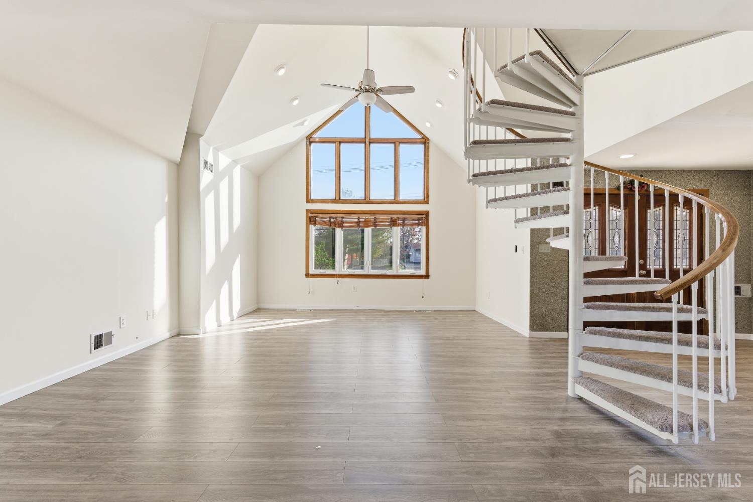 1818 Oak Tree Road Edison, NJ 08820 - Photo 7 of 15 wooden floor in an empty room with a window