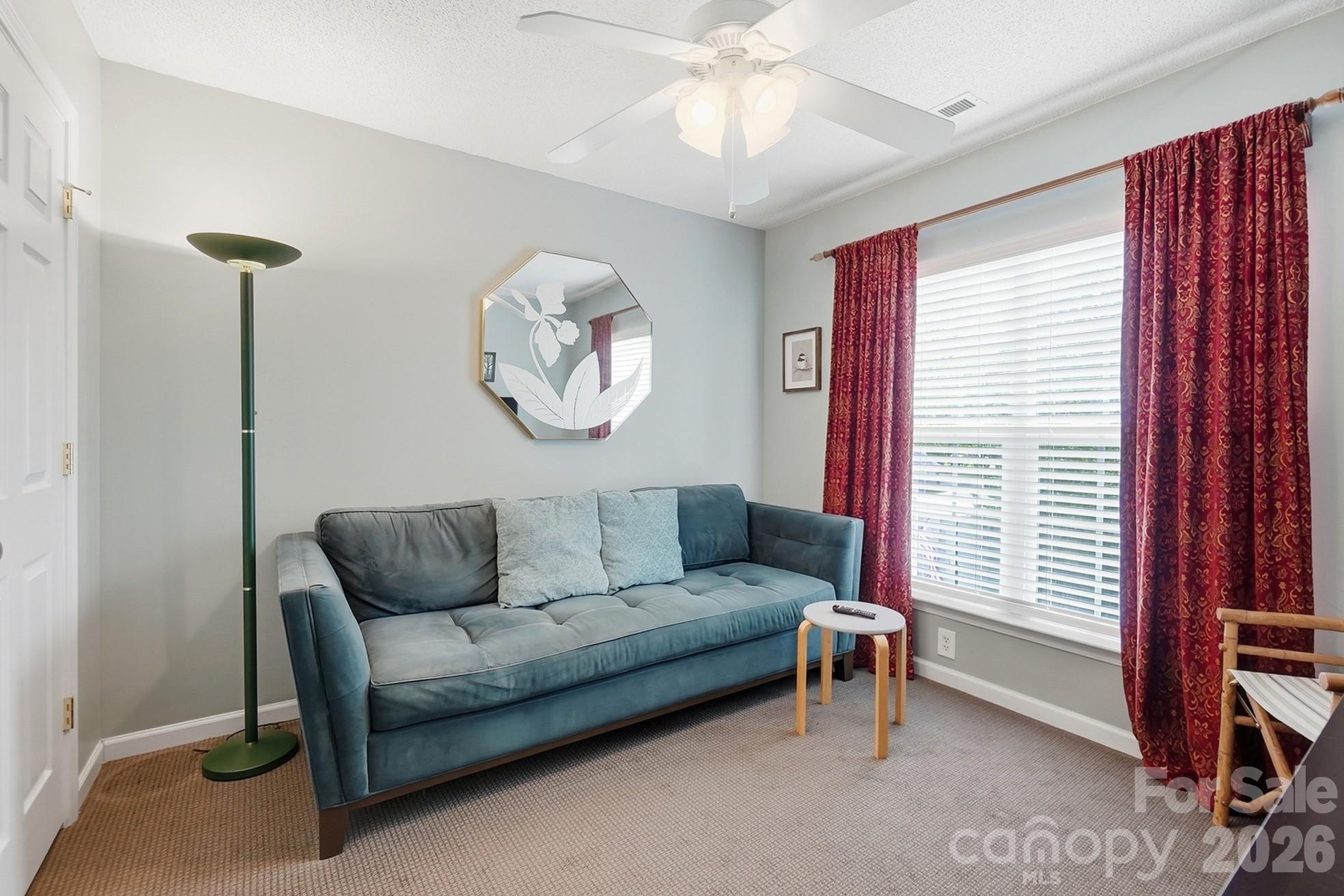 442 Sugar Maple Drive Tega Cay, SC 29708 - Photo 27 of 48 a living room with furniture and a window
