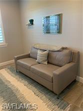 16390 Viansa Way, Unit 1202 Naples, FL 34110 - Photo 18 of 26 a living room with furniture and a window