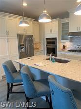 16390 Viansa Way, Unit 1202 Naples, FL 34110 - Photo 2 of 26 a view of kitchen with sink and breakfast area