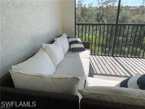 a view of balcony with furniture