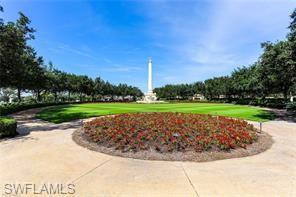 16390 Viansa Way, Unit 1202 Naples, FL 34110 - Photo 25 of 26 a view of a golf course with a park