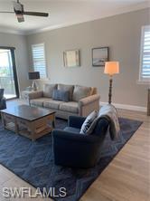 16390 Viansa Way, Unit 1202 Naples, FL 34110 - Photo 8 of 26 a living room with furniture and a window