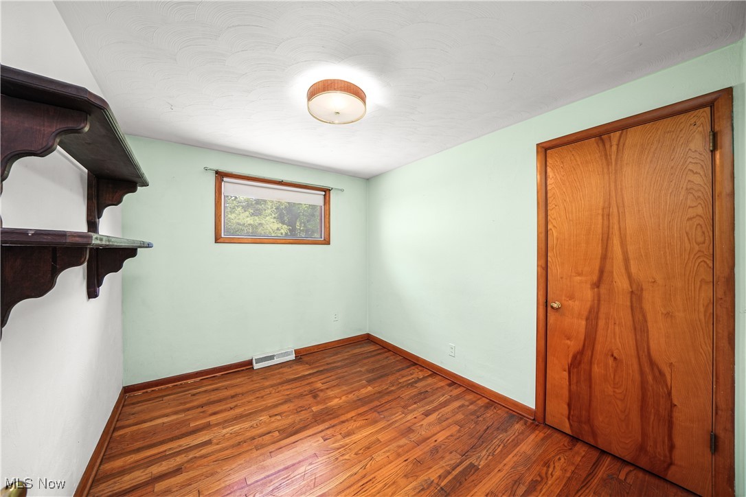 11828 Sheldon Road Mantua, OH 44255 - Photo 18 of 31 Bedroom with hardwood floors