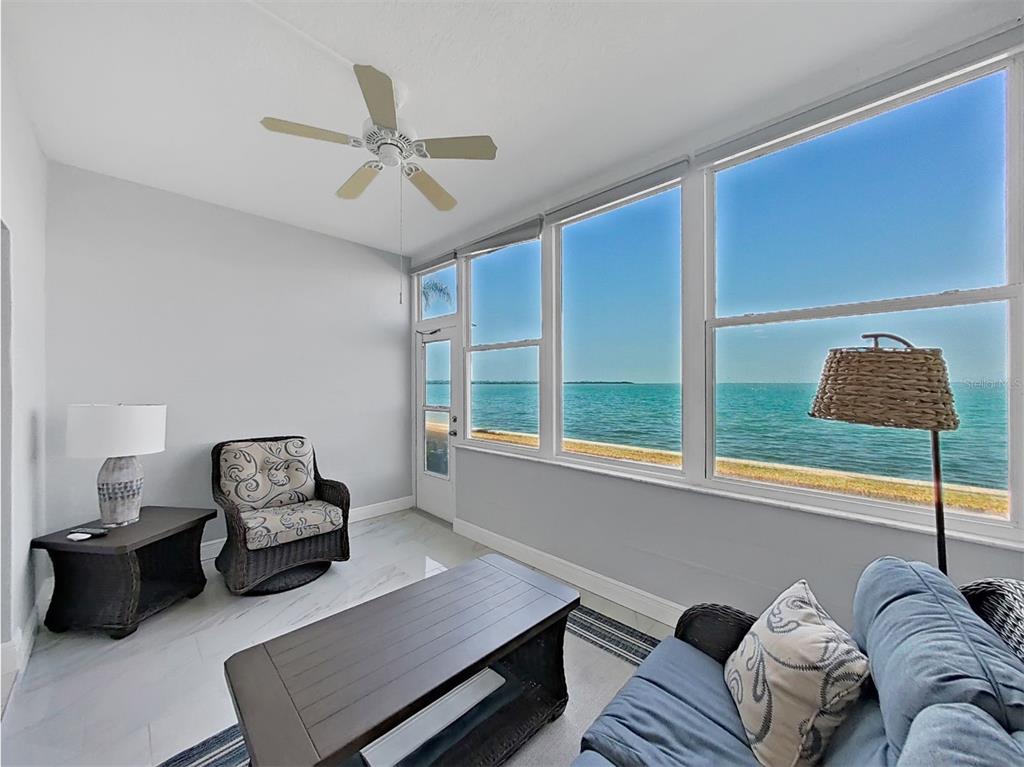 7 Dunoon Place, Unit 104 Dunedin, FL 34698 - Photo 21 of 45 a living room with furniture and a window