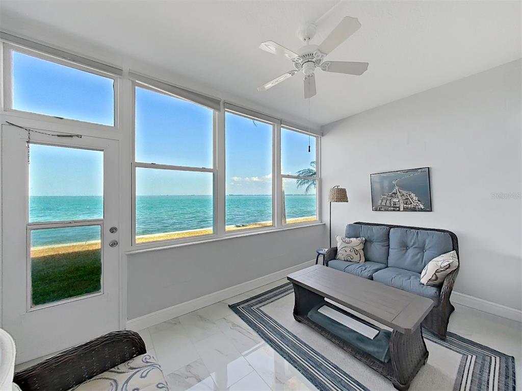 7 Dunoon Place, Unit 104 Dunedin, FL 34698 - Photo 22 of 45 a living room with furniture and a window
