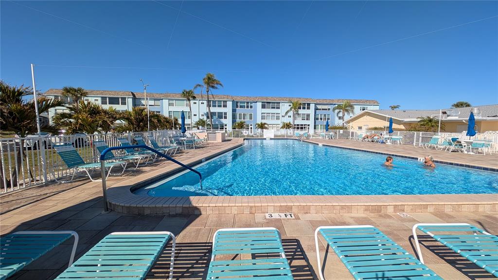 7 Dunoon Place, Unit 104 Dunedin, FL 34698 - Photo 39 of 45 a view of a balcony with two chairs