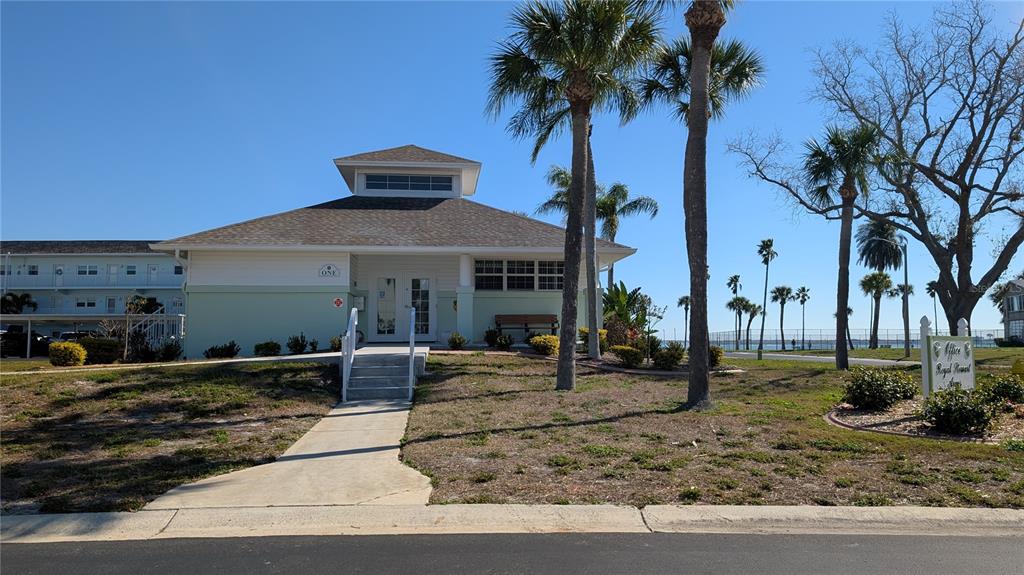 7 Dunoon Place, Unit 104 Dunedin, FL 34698 - Photo 43 of 45 a front view of a house with garden