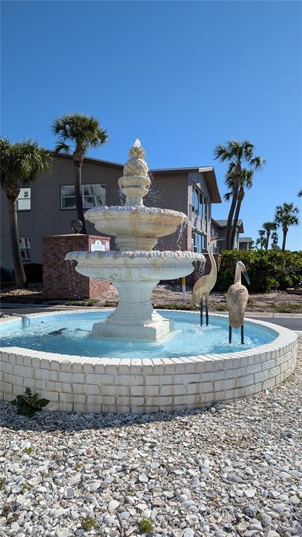 7 Dunoon Place, Unit 104 Dunedin, FL 34698 - Photo 44 of 45 a view of a house with a backyard