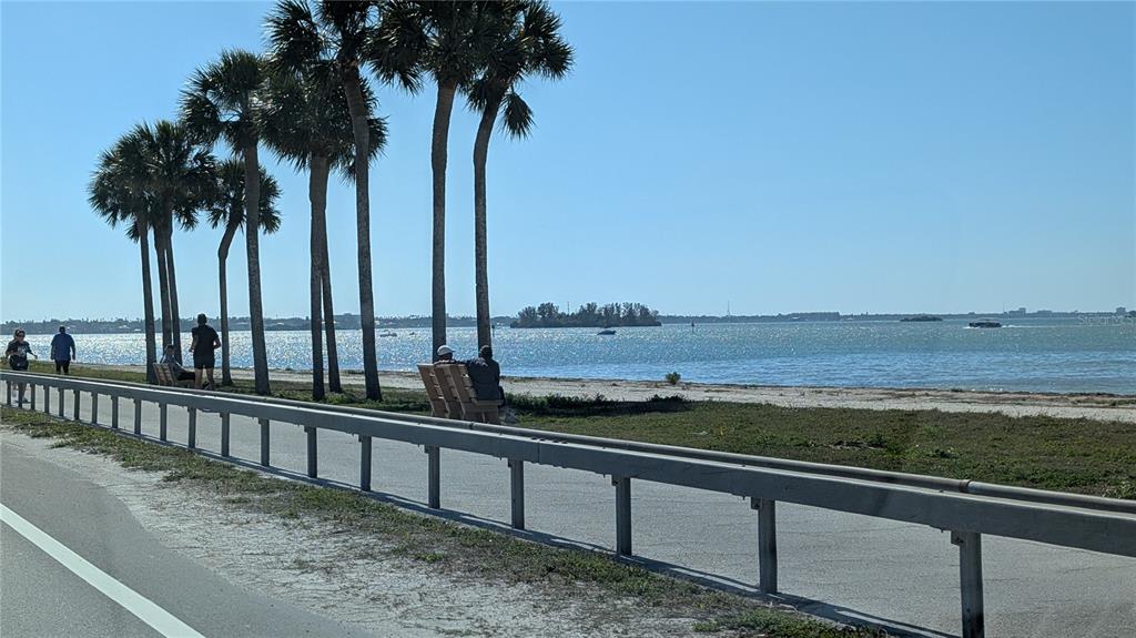 7 Dunoon Place, Unit 104 Dunedin, FL 34698 - Photo 45 of 45 a view of beach and ocean from a balcony
