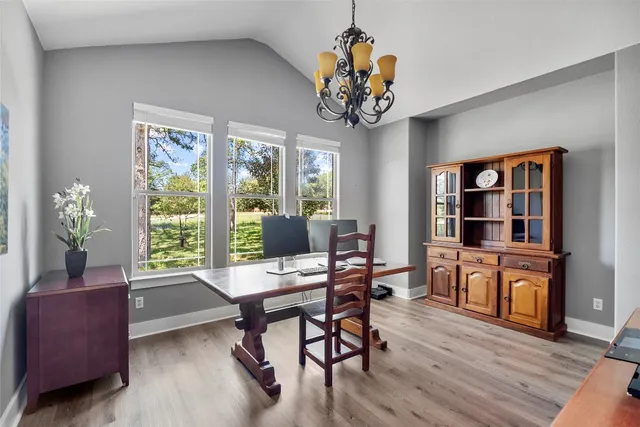 a view of a livingroom with furniture window and wooden floor